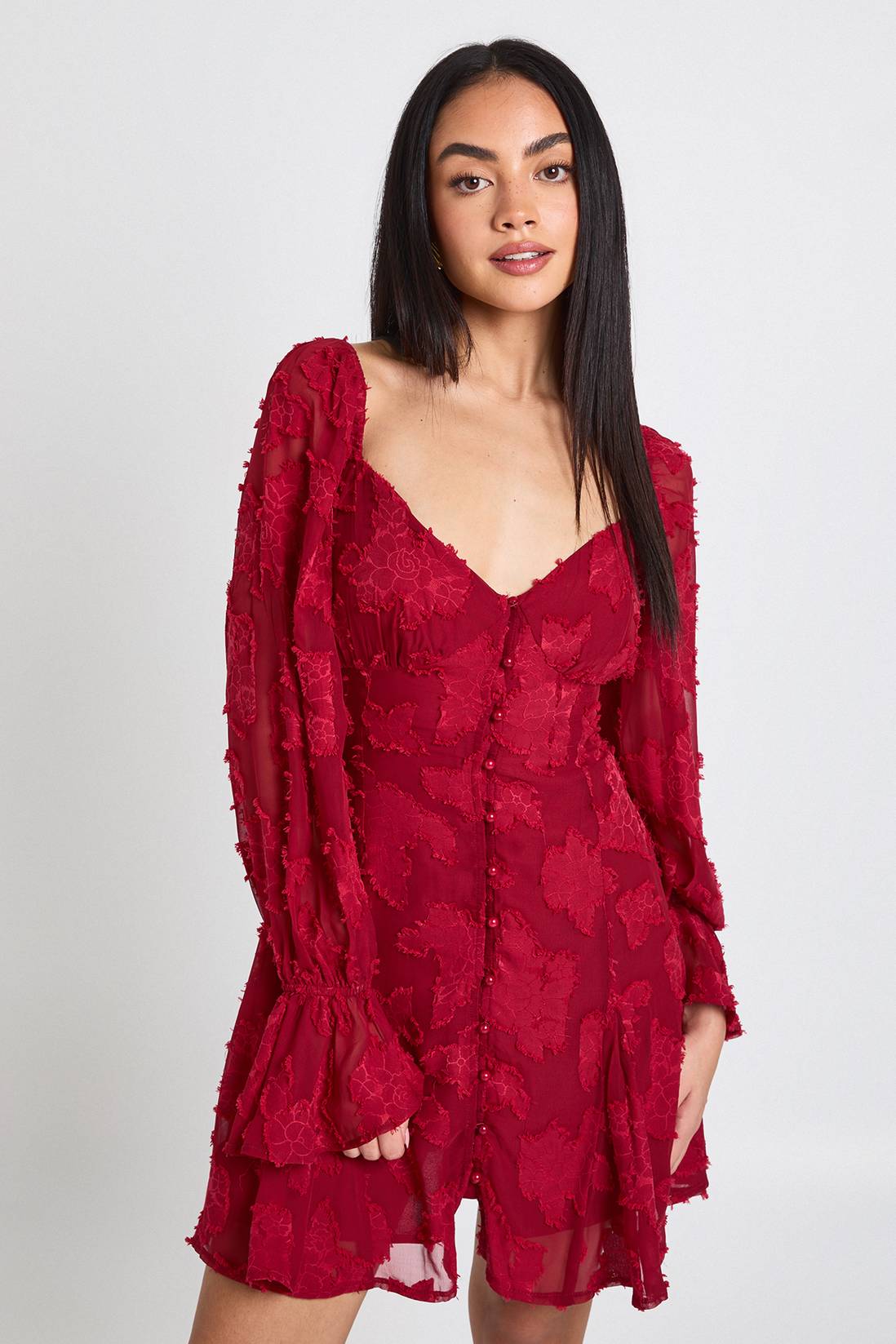 Mini dress with burnout floral texture bell sleeves and godet hem